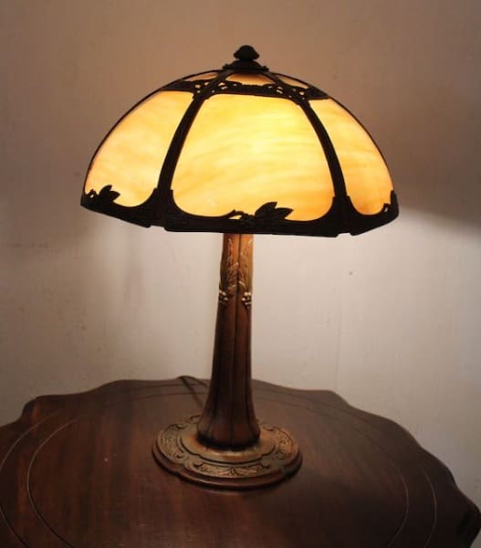 Antique lamp with stained glass shade.