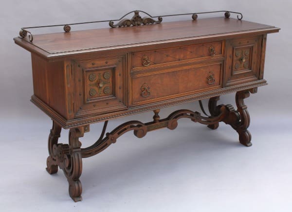 Ornate wooden sideboard with decorative carvings.