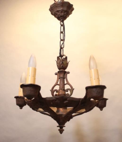 Vintage wrought iron chandelier with candles.