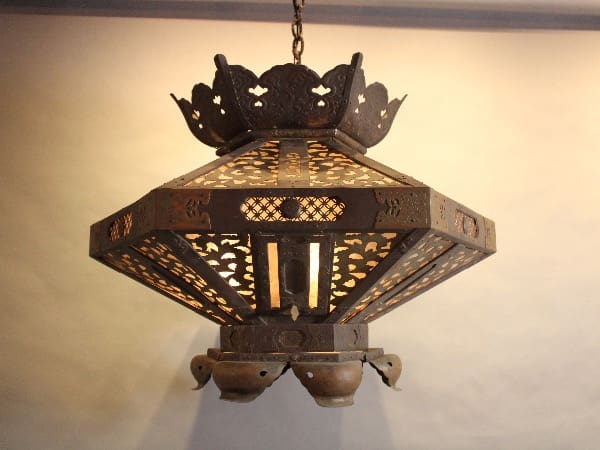 Ornate metal lantern with intricate patterns.