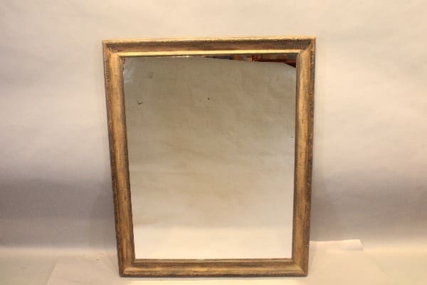 Rectangular mirror with a wooden frame.