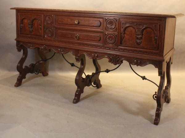 Ornate wooden sideboard with decorative carvings.