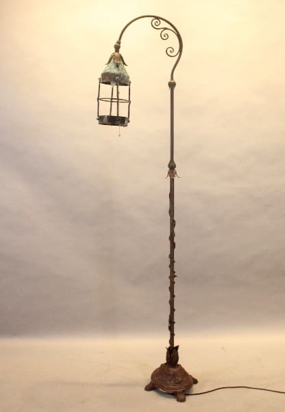 Ornate vintage floor lamp with lantern shade.