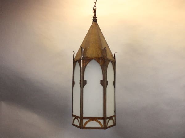 Vintage hanging lantern with metal frame.