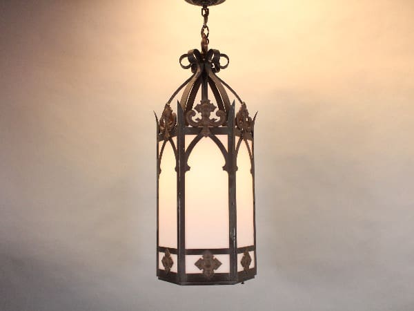 Gothic-style hanging lantern with soft glow.