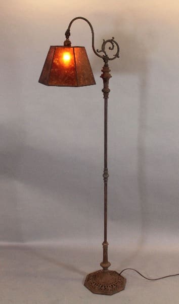 Vintage floor lamp with ornate design.