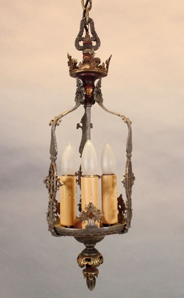 Ornate vintage chandelier with candle-like bulbs.