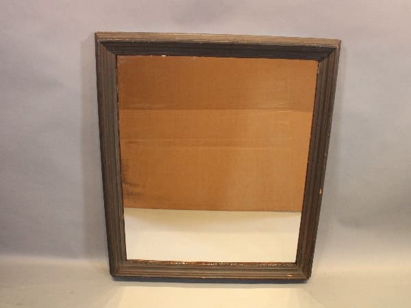 Rectangular mirror with a wooden frame.