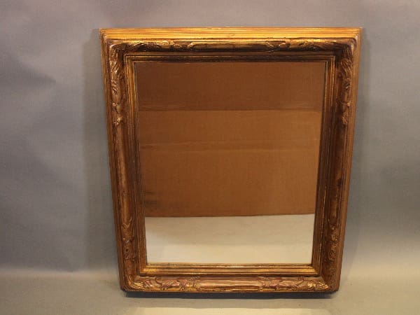 Antique wooden frame with intricate carvings.