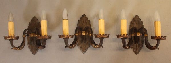 Vintage wall sconces with candle-shaped bulbs.
