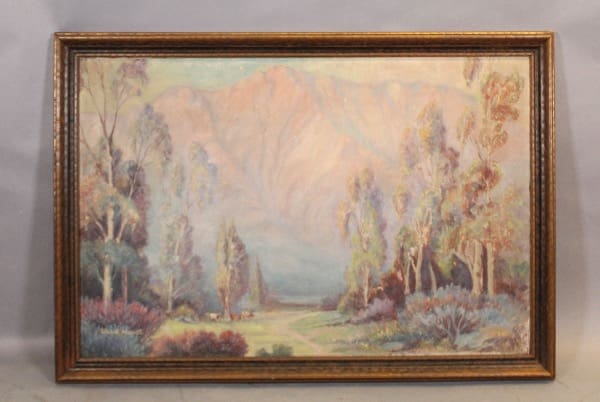 Framed landscape painting of trees and mountains.