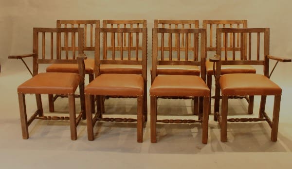 Set of eight wooden chairs with cushions.