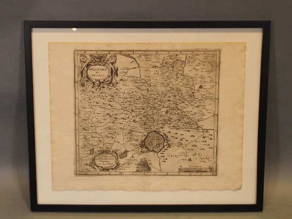 Framed vintage map with detailed geographic features.
