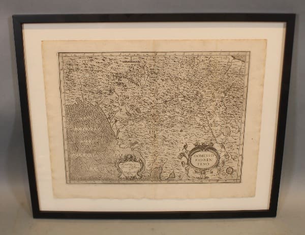 Framed vintage map with detailed engravings.