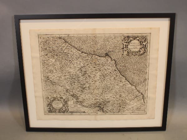 Framed antique map of a region.