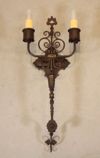 Vintage wall sconce with two candle lights.