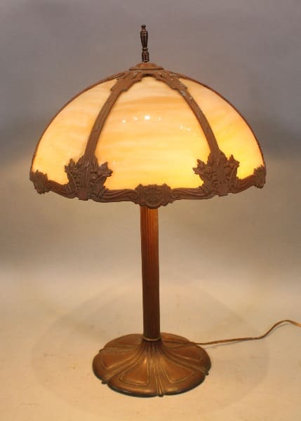 Antique table lamp with stained glass shade.