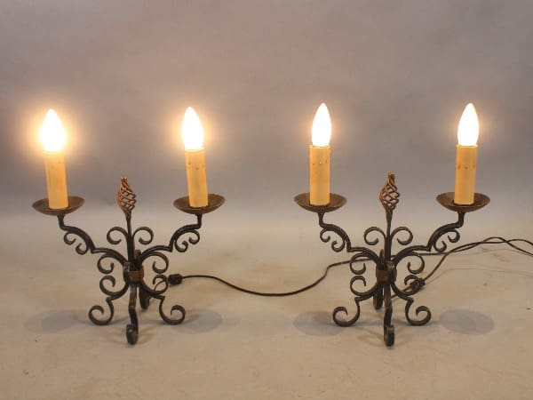 Ornate metal candelabras with lit candles.