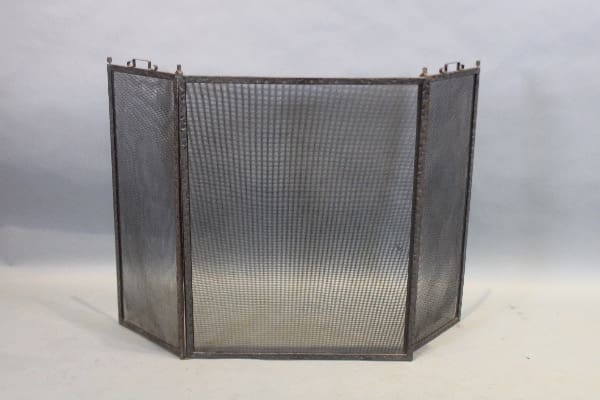 Three-panel metal fireplace screen.