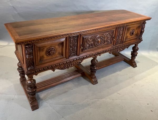 Ornate wooden sideboard with carved details.