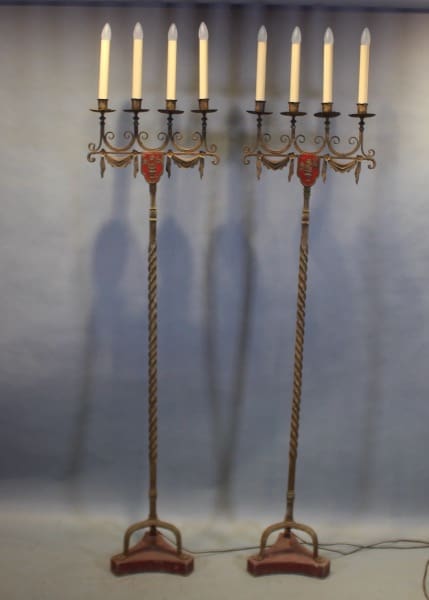 Two ornate candelabra with lit candles.
