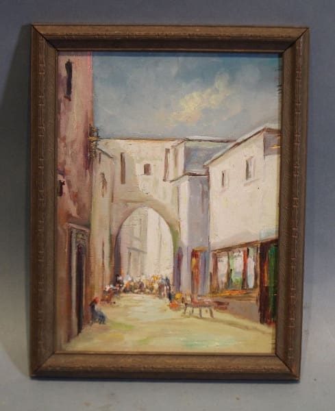 Framed painting of a street scene.