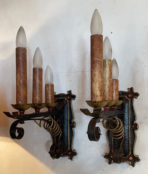 Vintage wall sconces with candle-shaped bulbs.