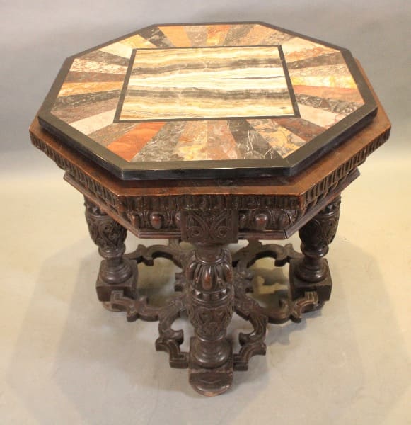 Octagonal ornate wooden table with colorful inlay.