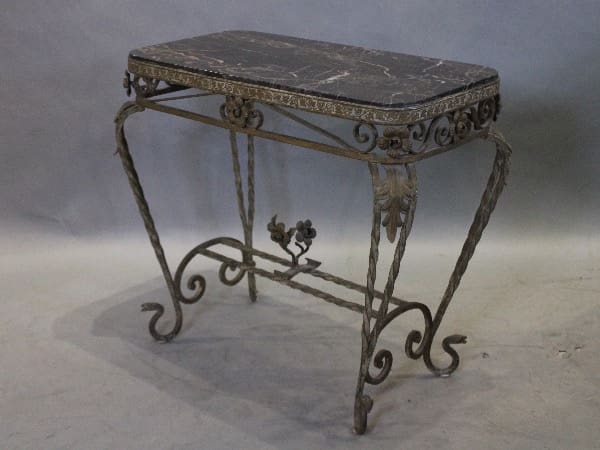 Antique wrought iron table with marble top.