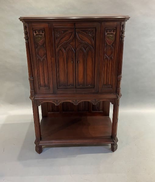 Ornate wooden cabinet with Gothic design elements.