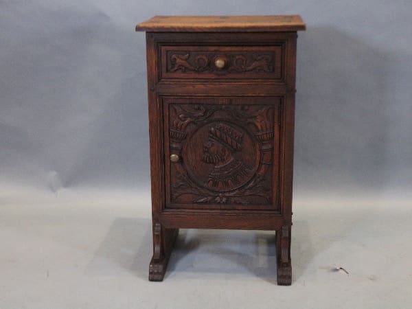 Ornate wooden cabinet with carved details.