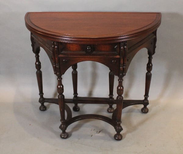 Antique wooden half-moon console table.