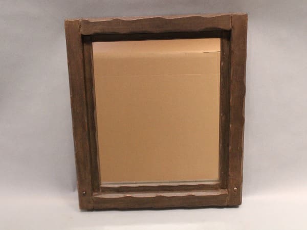 Wooden frame with cardboard background.
