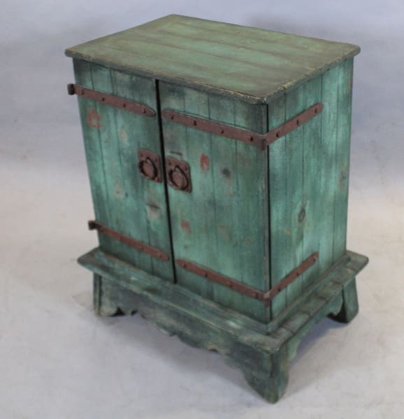 Antique green wooden cabinet with two doors.