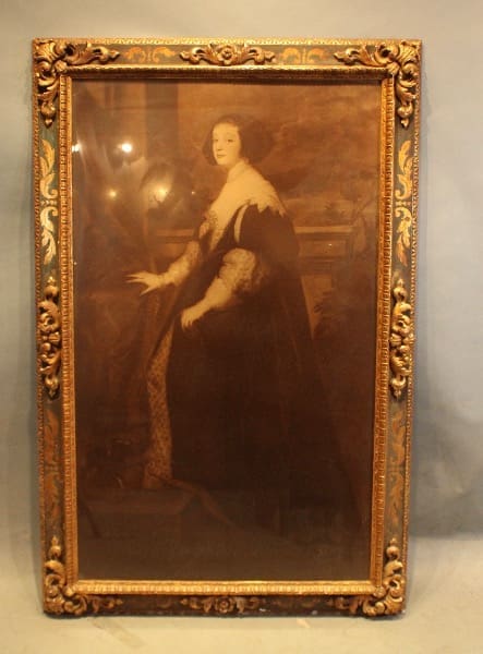 Framed portrait of a historical figure.