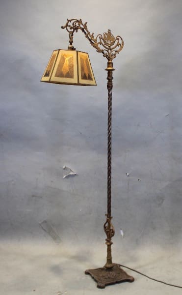 Ornate vintage floor lamp with decorative shade.