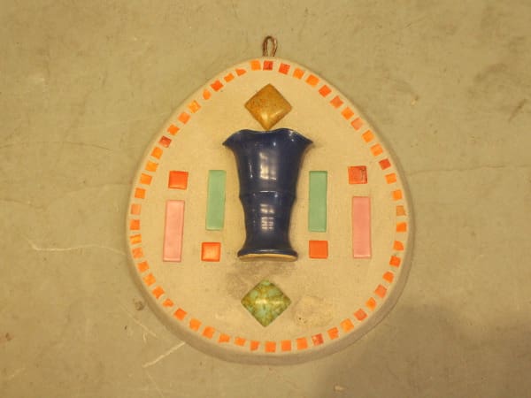 Colorful geometric ceramic wall hanging design.