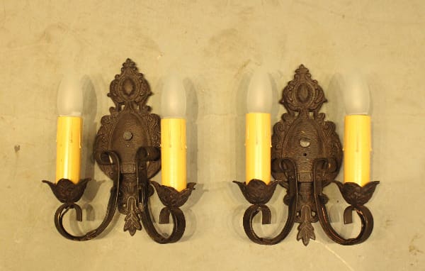 Vintage wall sconces with candle-shaped bulbs.