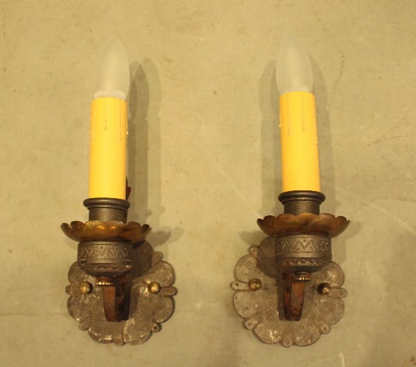 Vintage wall sconces with candle-shaped bulbs.