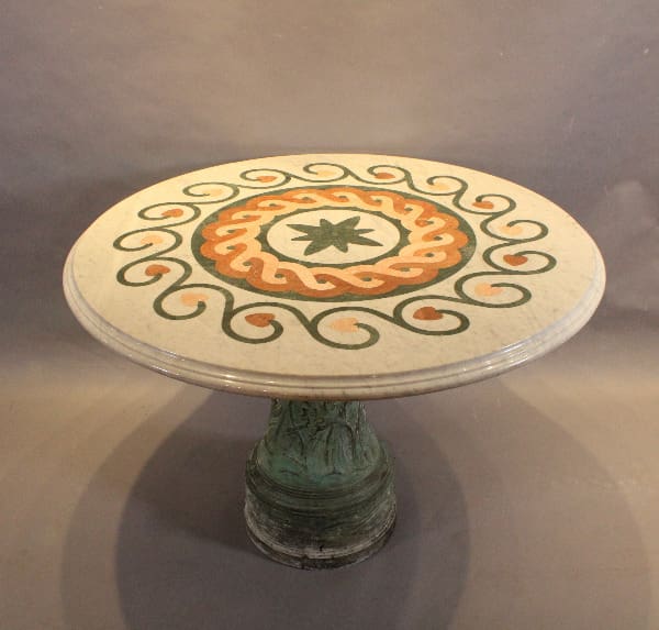 Ornate round table with colorful spiral design.