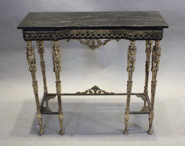 Ornate vintage table with intricate carvings.