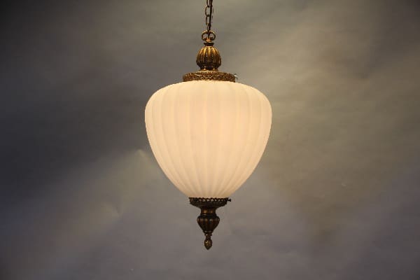 Elegant pendant light with ornate detailing.