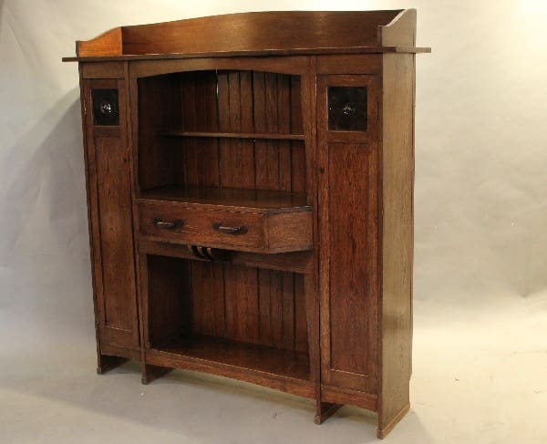 Wooden antique cabinet with shelves and drawers.