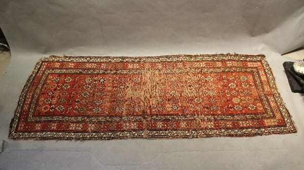 Antique red patterned rectangular rug.