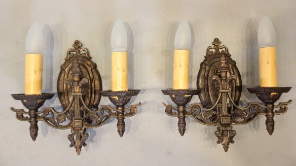 Vintage double-arm wall sconces with bulbs.