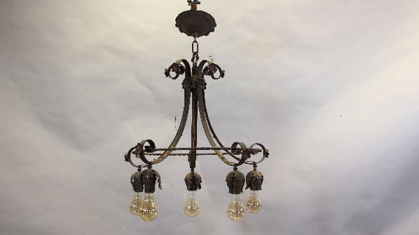 Vintage chandelier with five exposed bulbs.