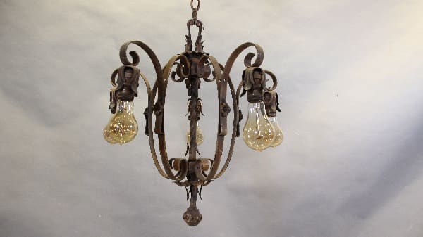 Vintage wrought iron chandelier with Edison bulbs.