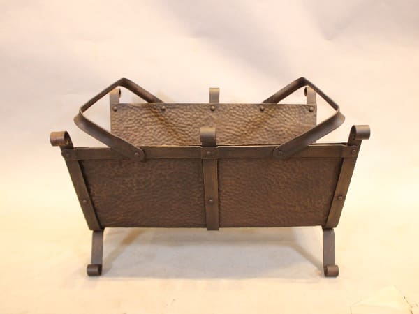 Metal firewood holder on white background.