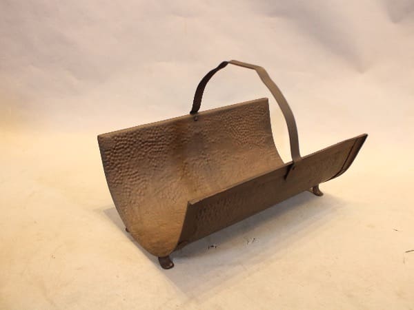 Metal log holder with curved design.