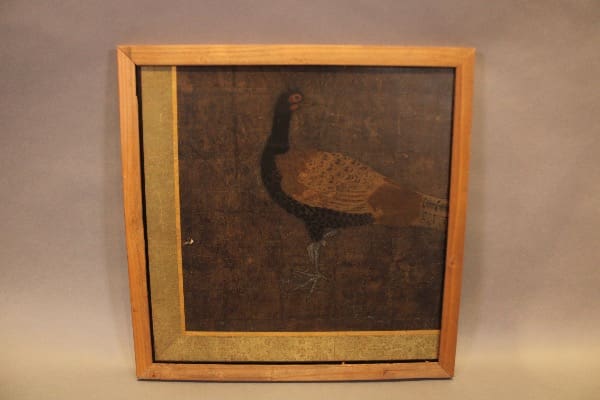 Framed painting of a bird on canvas.